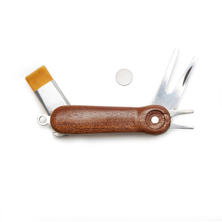 Multi golf tool with wooden handle and various tools on a white background