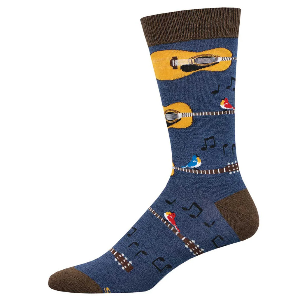 Blue sock with guitar and music note patterns on a white background