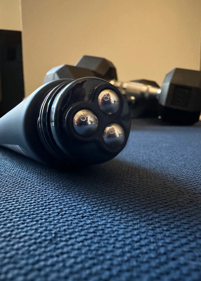 A closeup of the applicator for Oars + Alps Muscle Recovery Balm.