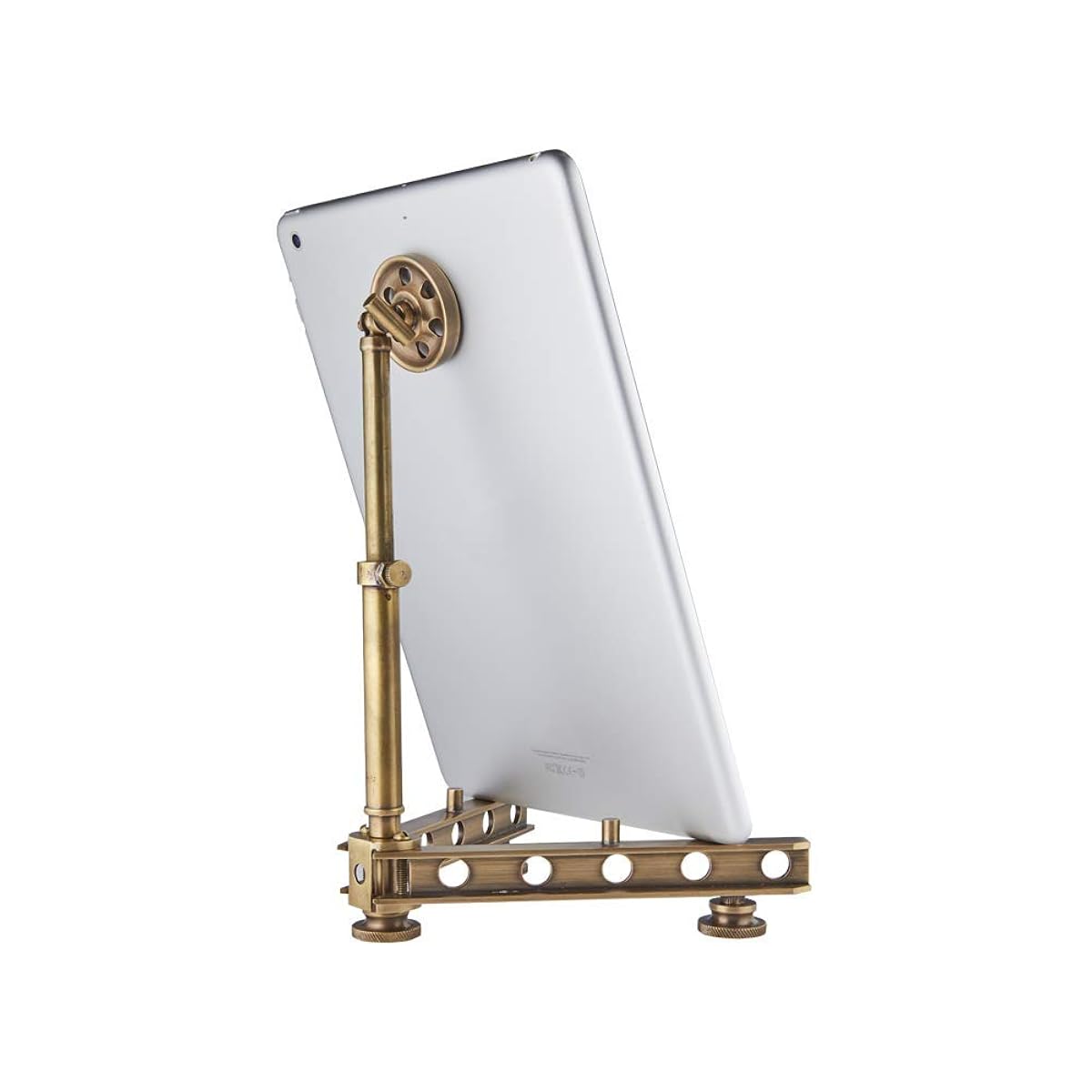 Brass tablet stand holding a white tablet on a white background