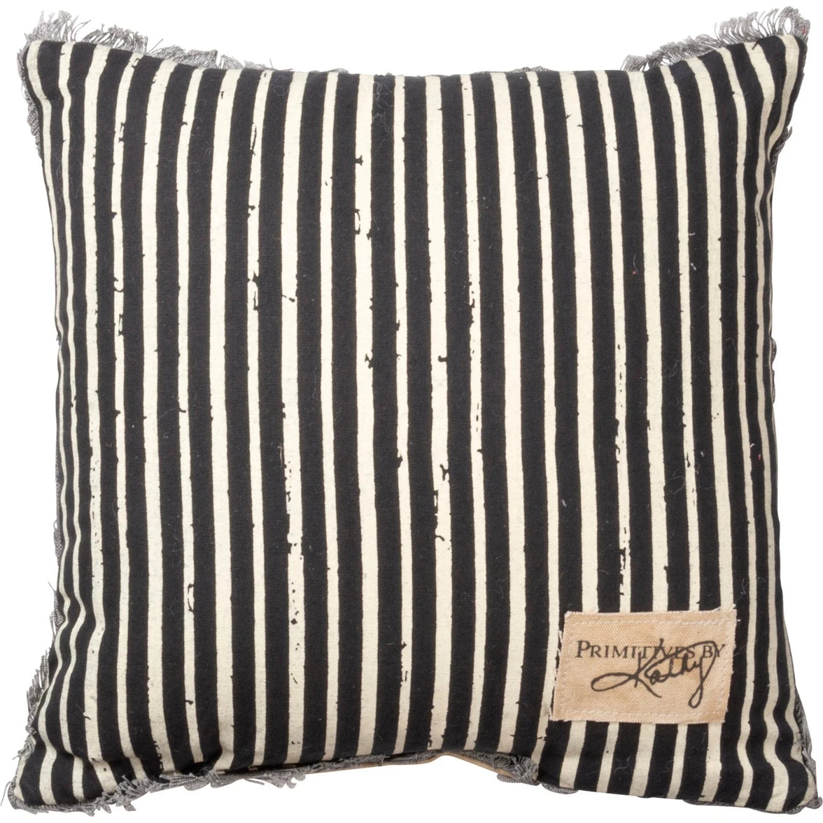 Striped pillow with black and white pattern and a visible brand label on a white background