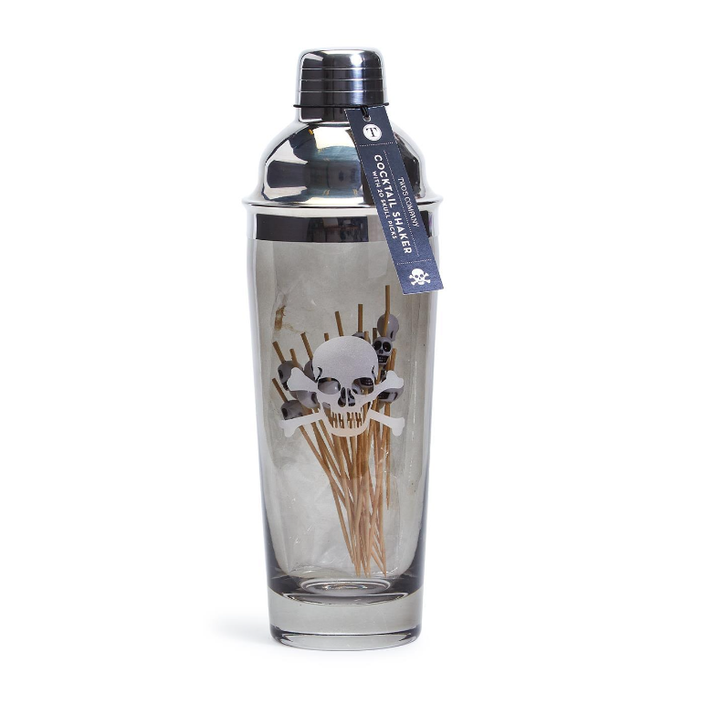 Clear cocktail shaker with skull design and silver top on a white background