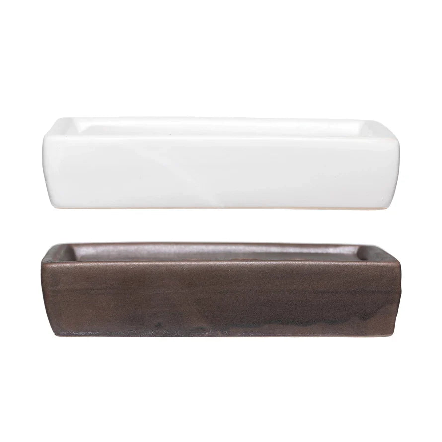 White and brown stoneware soap dishes with removable trays on a white background
