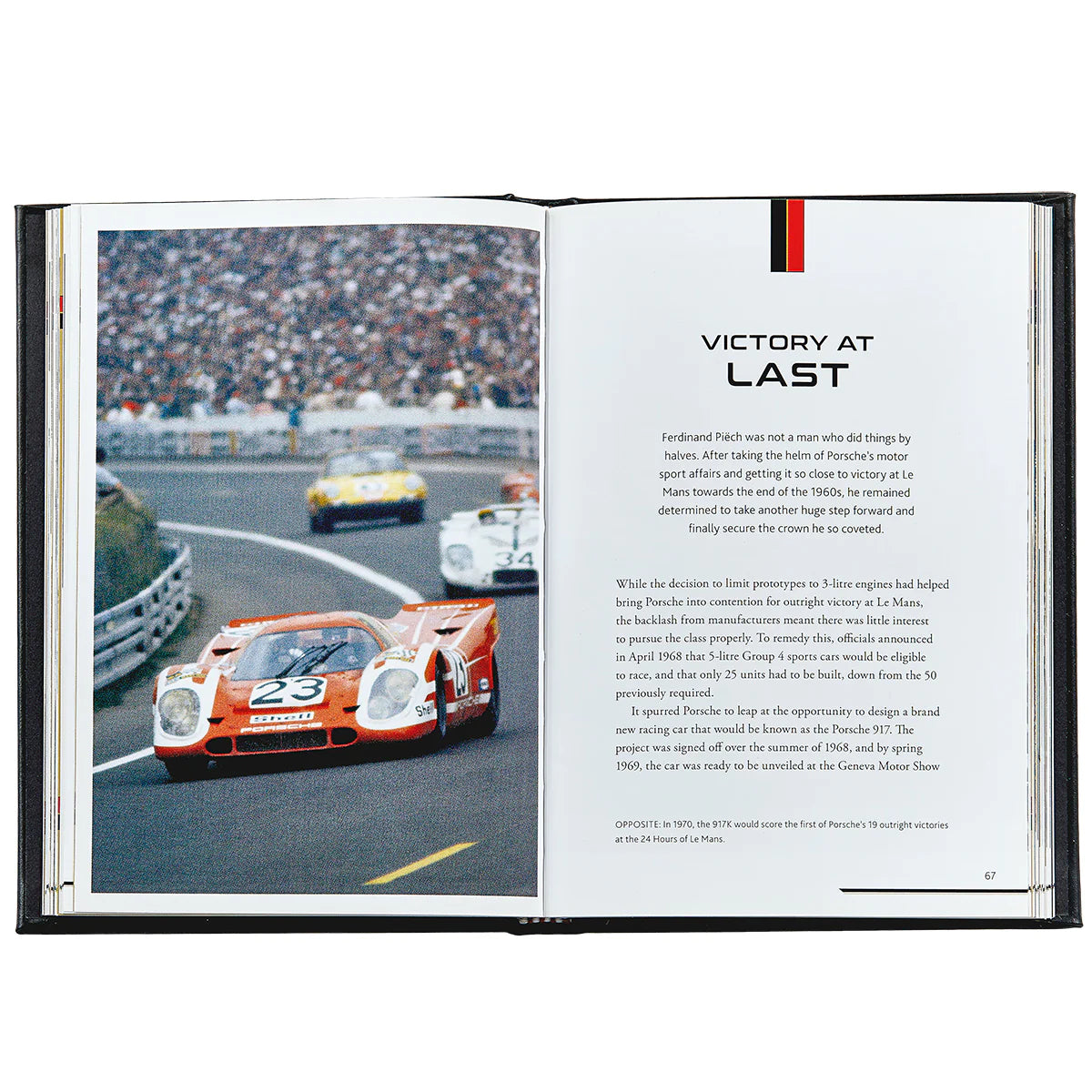 An inside look at a book titled The Story of Porsche open to the chapter 'Victory at Last' and an image of a racing car made  by Porsche.
