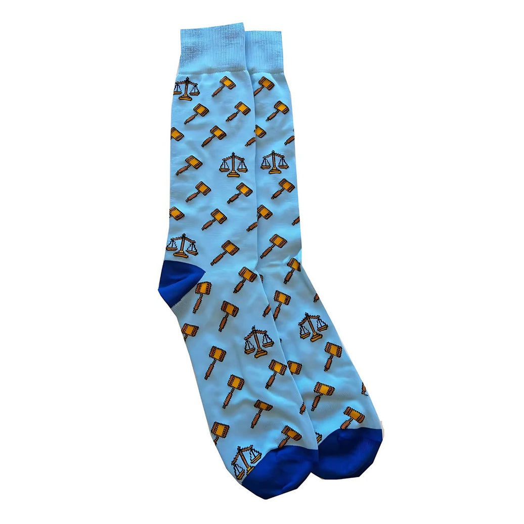 Light blue socks with gavel and scale pattern on a white background