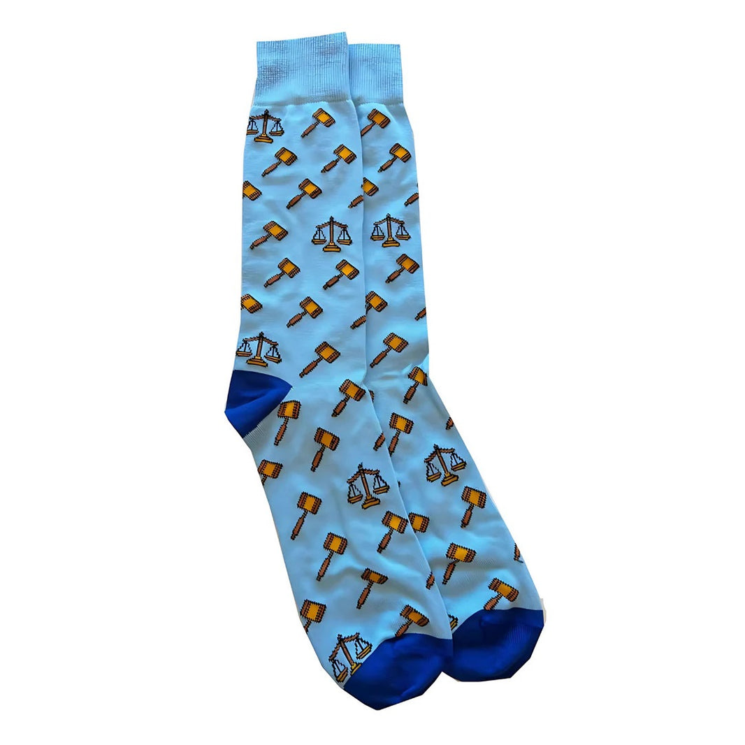 Light blue socks with gavel and scale pattern on a white background