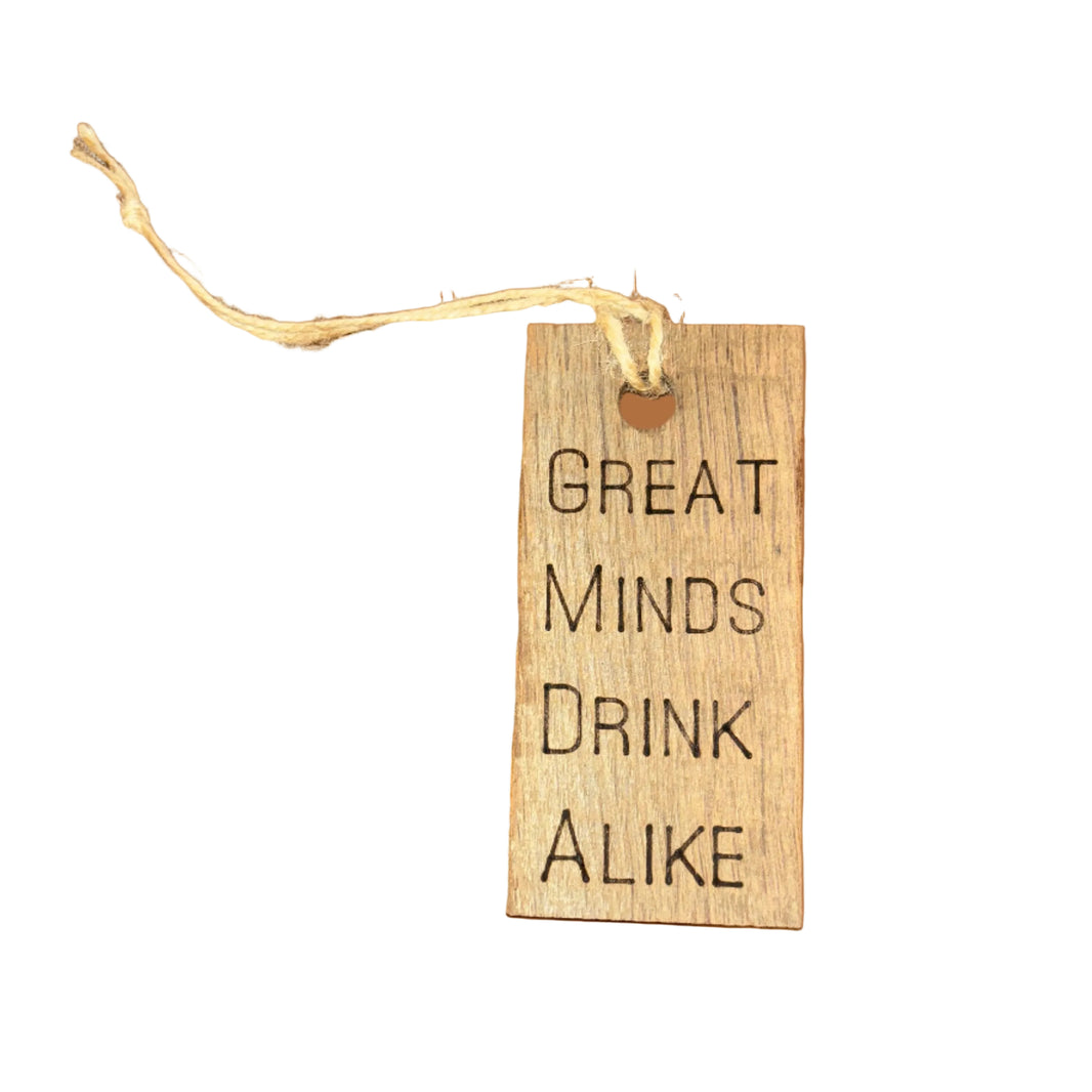 Wooden tag with 'Great Minds Drink Alike' text on a white background
