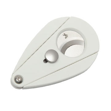 A white Xi2 cigar cutter with a carbon fiber-like pattern, featuring a blade and a cap, designed to cut cigars.

