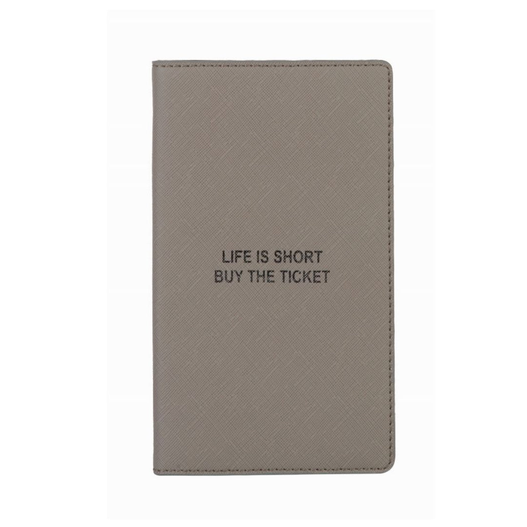 A gray passport cover with the quote "Life is short buy the ticket" on the cover.