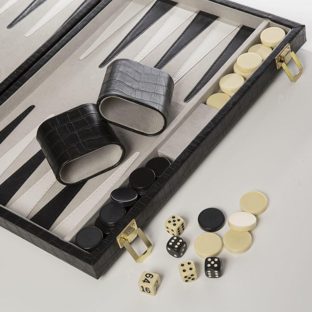A backgammon board in faux black crocodile color, with leather-cased dice and chip storage, displayed with dice and chips.