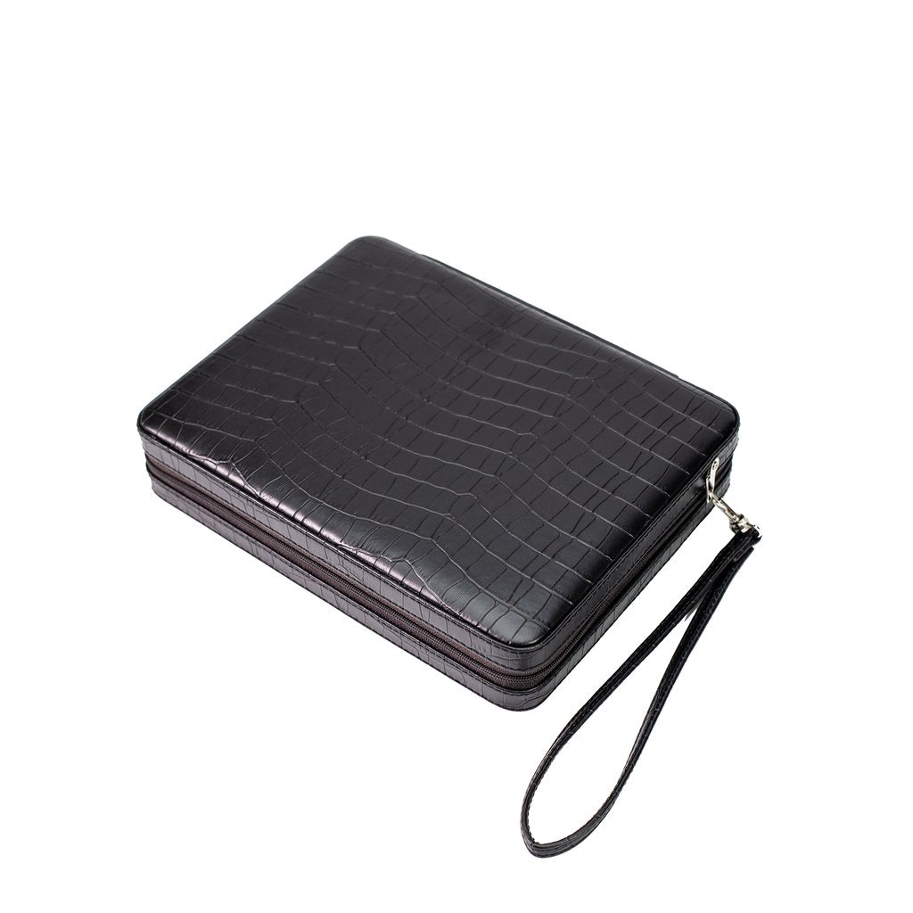 A closed travel backgammon case in faux leather crocodile.