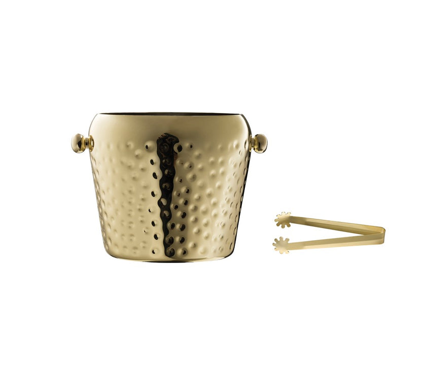 A gold hammered stainless steel ice bucket with tongs.