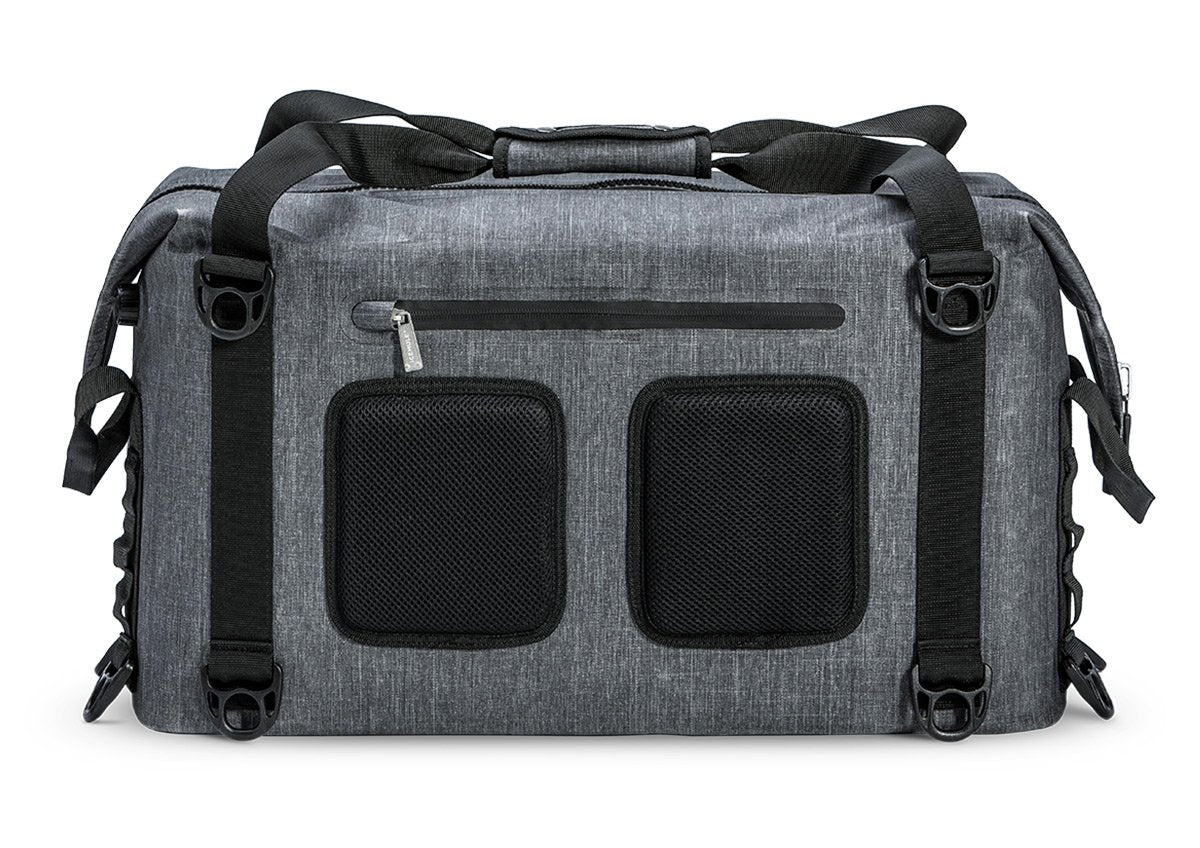 A gray Ice Mule Traveler soft cooler with a black top zipper and side straps, featuring multiple pockets.