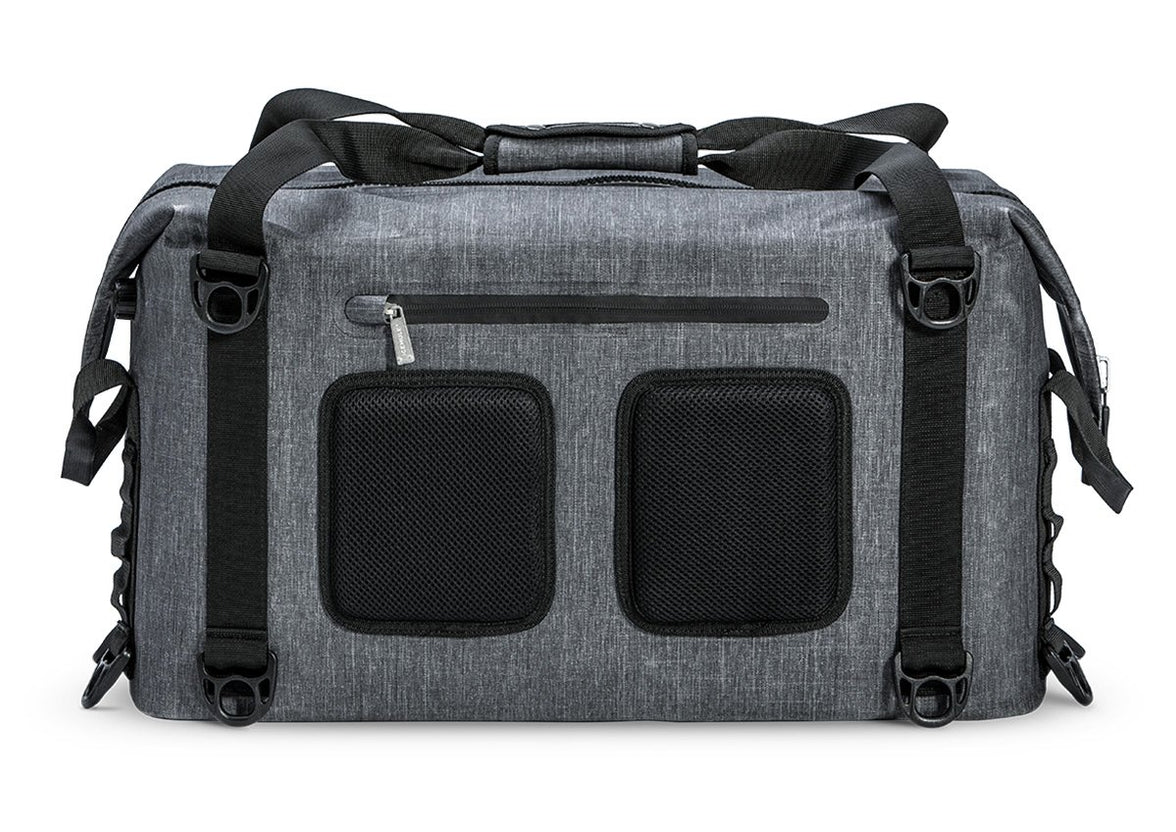 A gray Ice Mule Traveler soft cooler with a black top zipper and side straps, featuring multiple pockets.