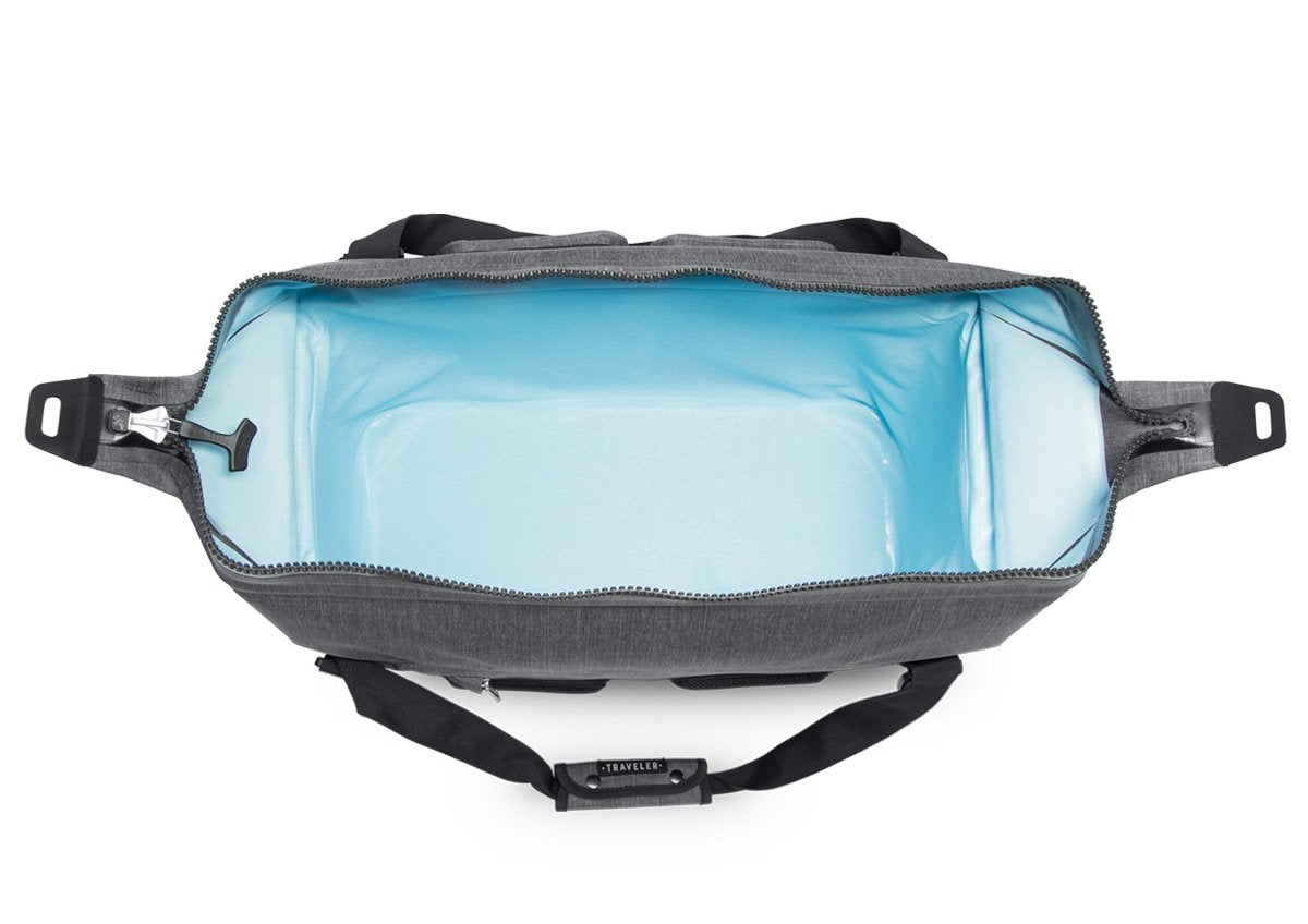 The blue interior of a gray Ice Mule Traveler soft cooler.