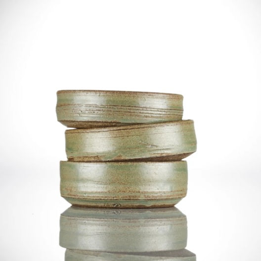 A stack of three handmade shaving bowls on a white background.