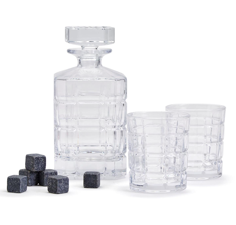 A connoisseur set that includes a glass liquor decanter, two rocks glasses, and whiskey stones
