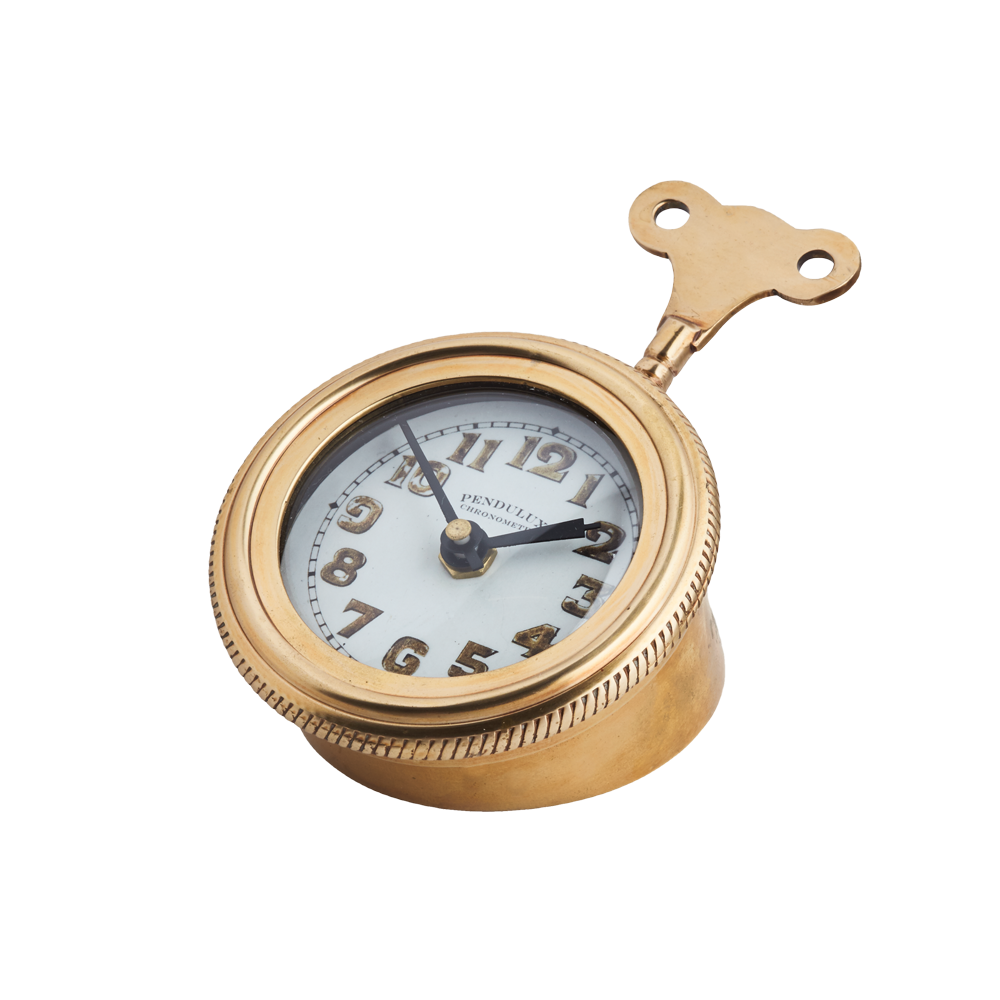 A golden colored table clock with a wind up key in the back.