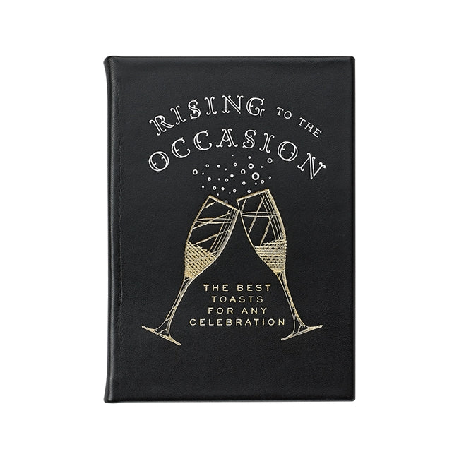 A black leather bound book titled 'Rising to the Occasion' with a celebratory toast design on the cover.