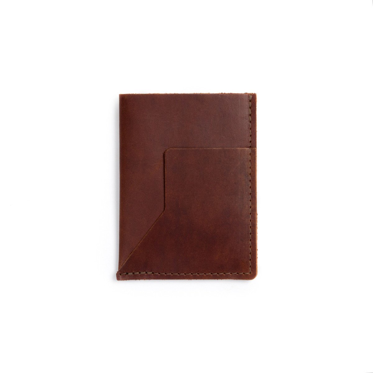 A burgundy leather passport sleeve on a white background.