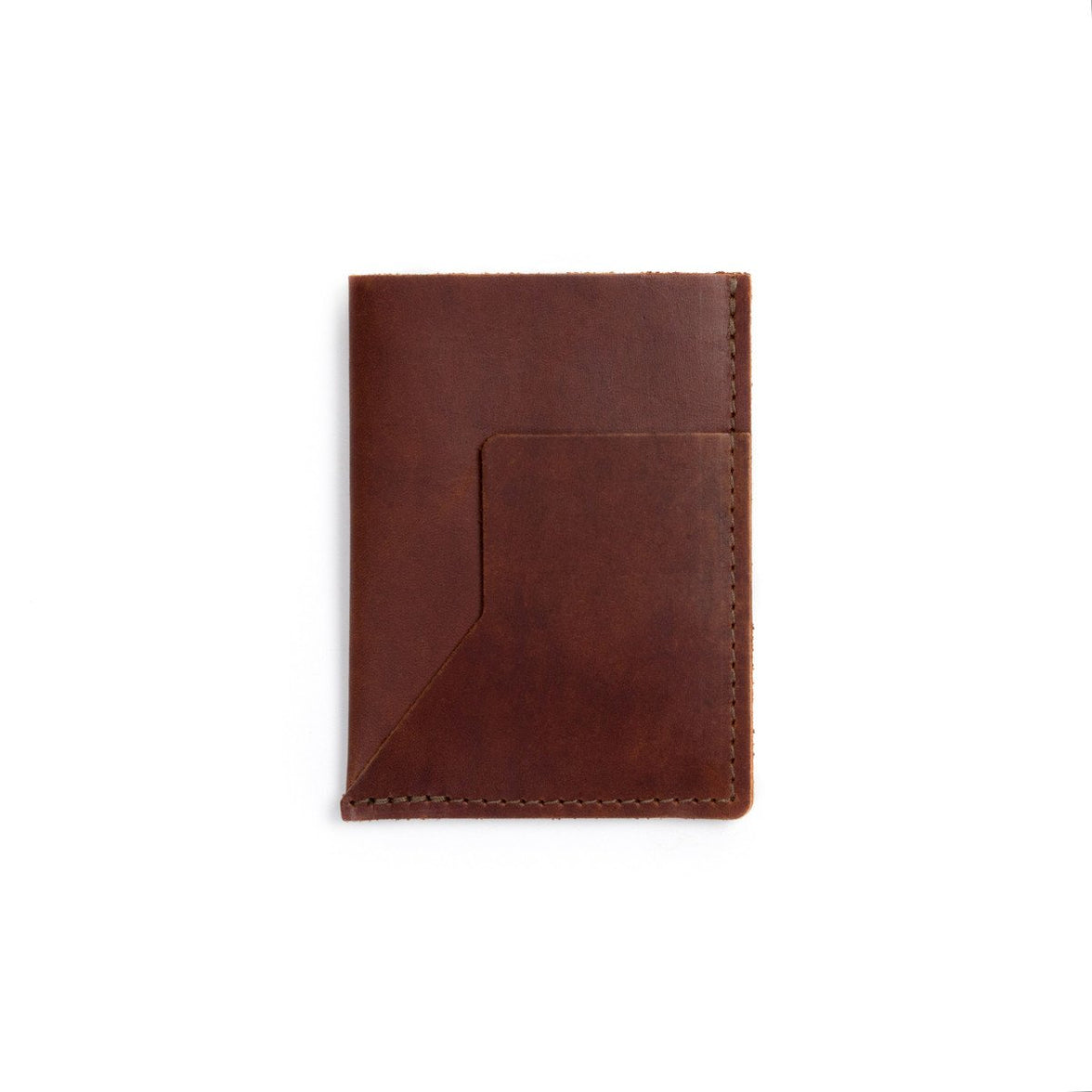 A burgundy leather passport sleeve on a white background.