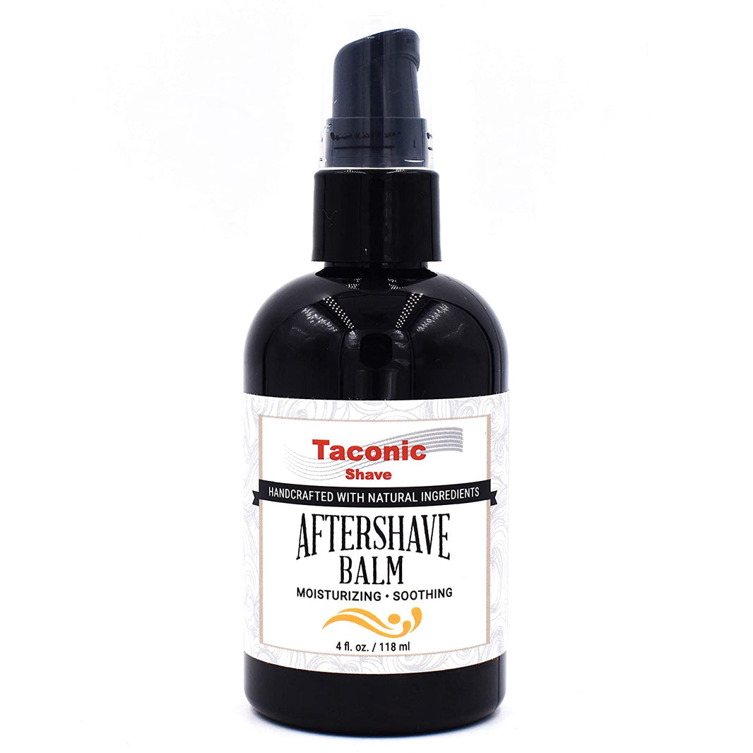 A black bottle of Taconic After Shave Balm with a white and orange label, unscented, containing 4 oz. (120 ml).