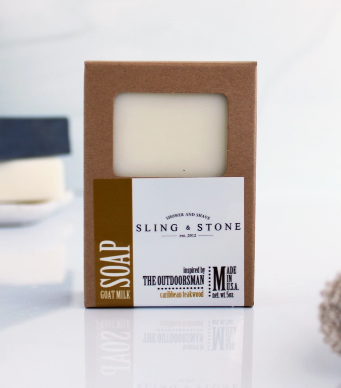 Bar of caribbean teakwood soap in a cardboard box with 'Sling & Stone' branding on a white background