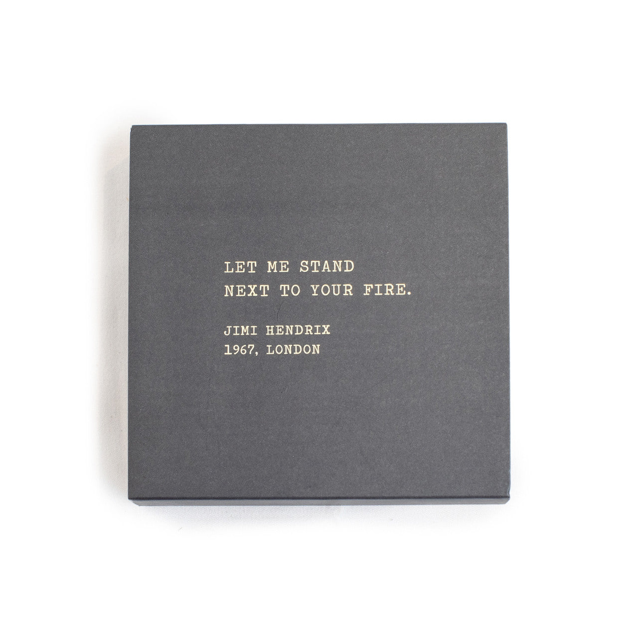 A box of matches with a gray background and a quote by Jimi Hendrix written on it.