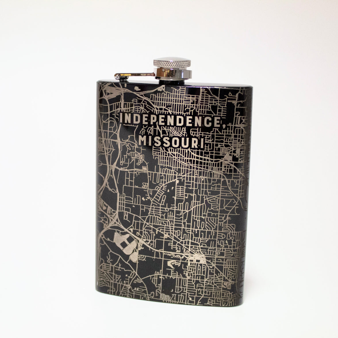 A black and silver flask with an etched map of Independence, Missouri.