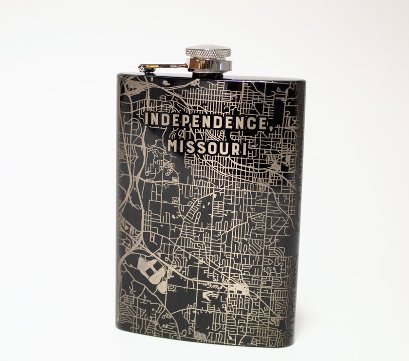 A black and silver flask with an etched map of Independence, Missouri.
