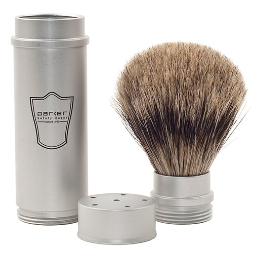 Shaving brush with silver handle and black bristles on a white background