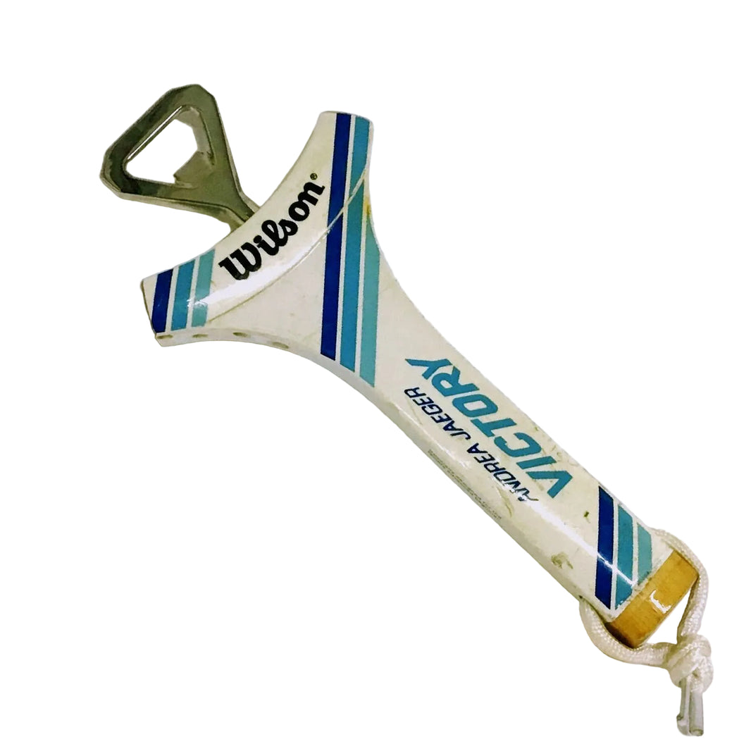 Tennis racket-shaped bottle opener with Wilson branding and the text 'Andrea Jaeger Victory' on a white background